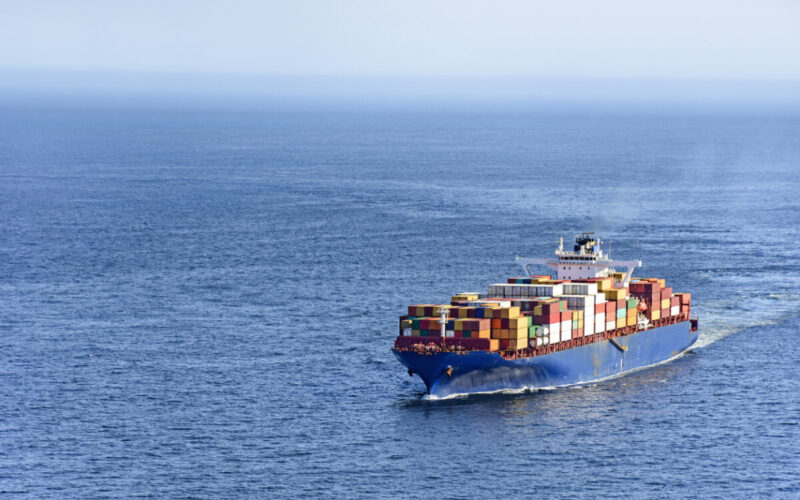 Cargo ship carrying several containers on the waters of the sea of rio de Janeiro, Brazil